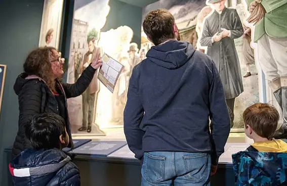 A family admiring exhibits in a museum.