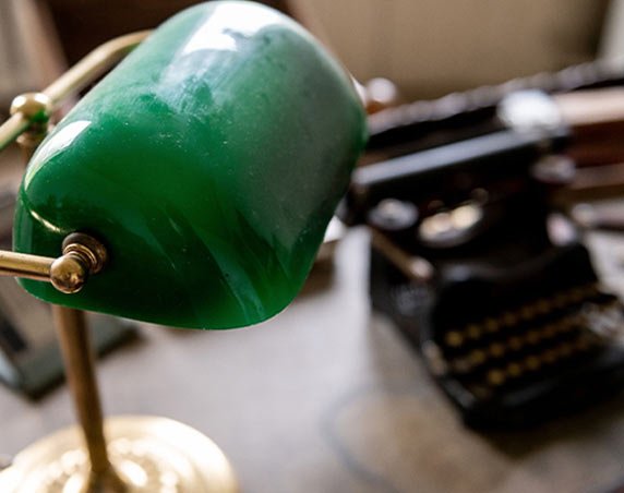 A close up of an old green lamp.