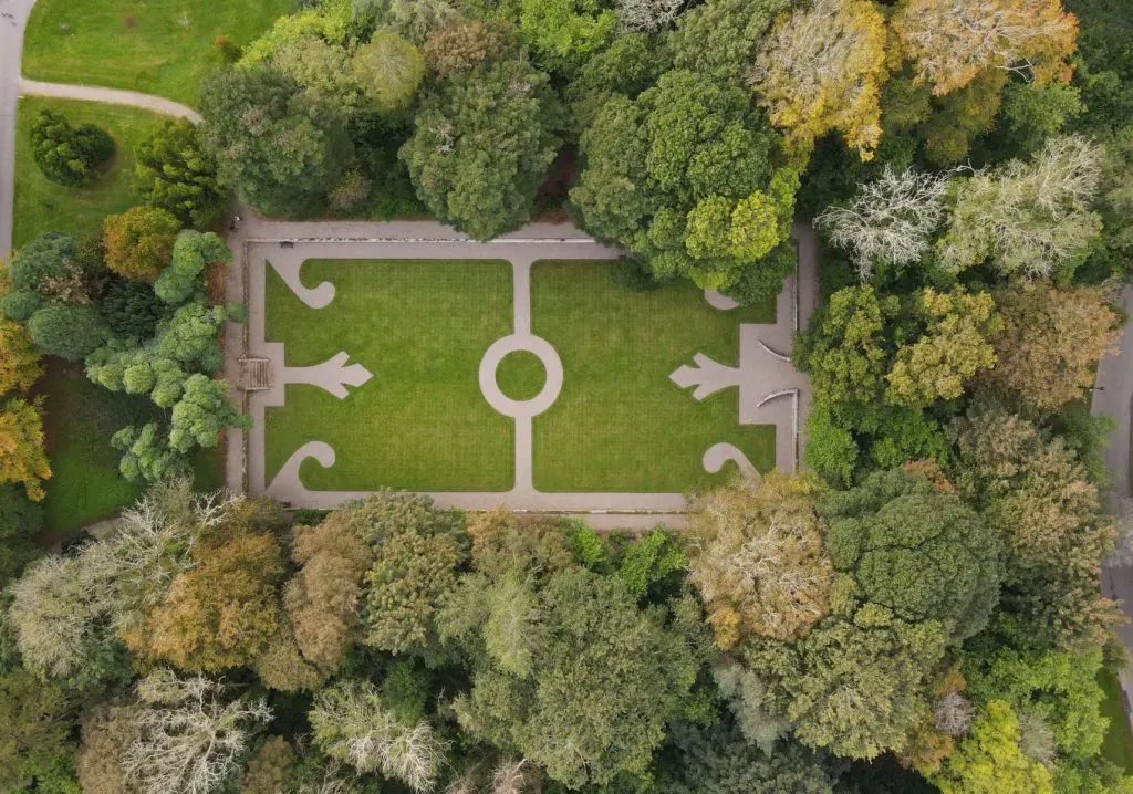 Top aerial view of a rectangular garden featuring beautifully trimmed grass.