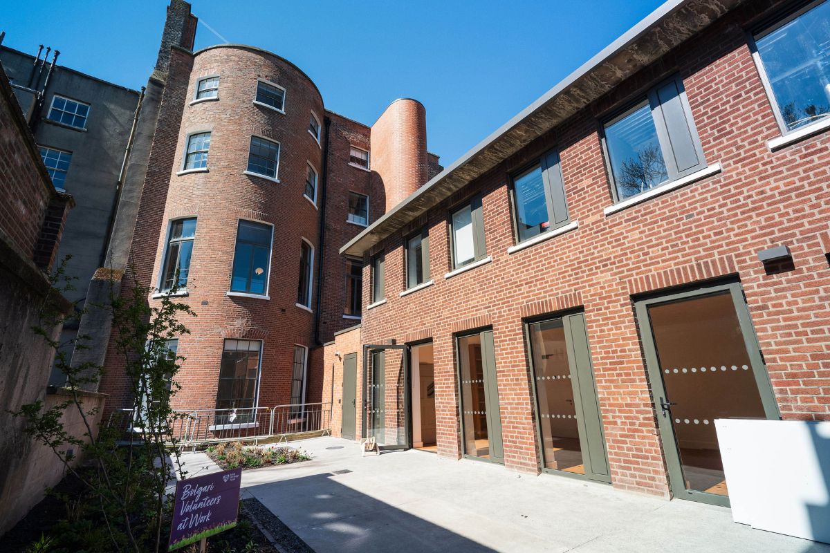 The rear of a terraced Georgian building with a rounded facade