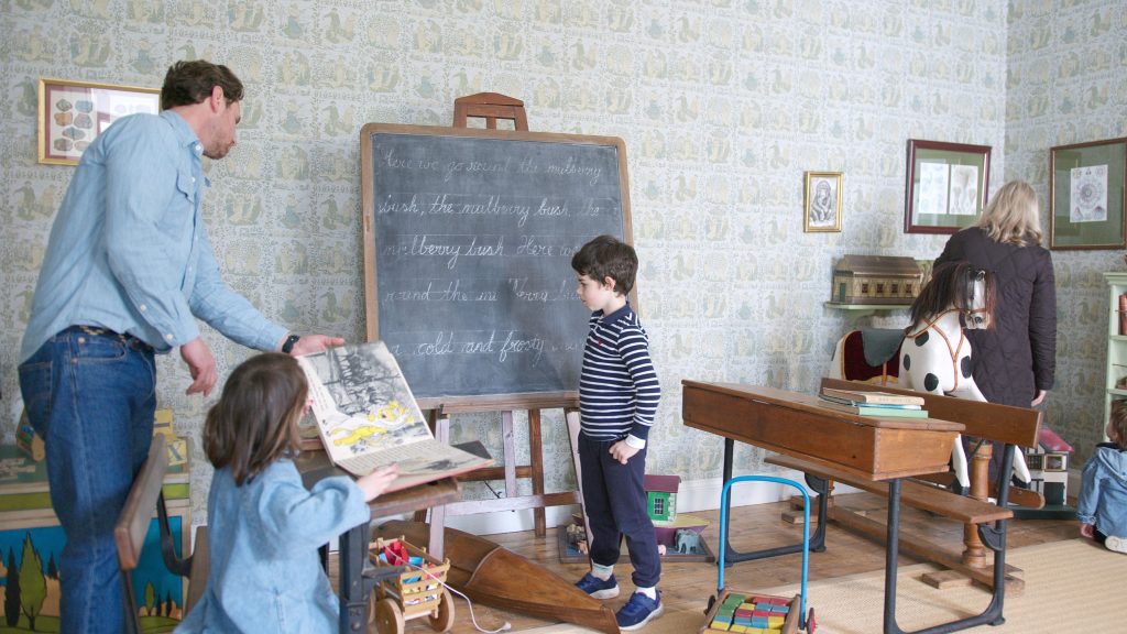 A family touring a child's bedroom at Fota House in Cork